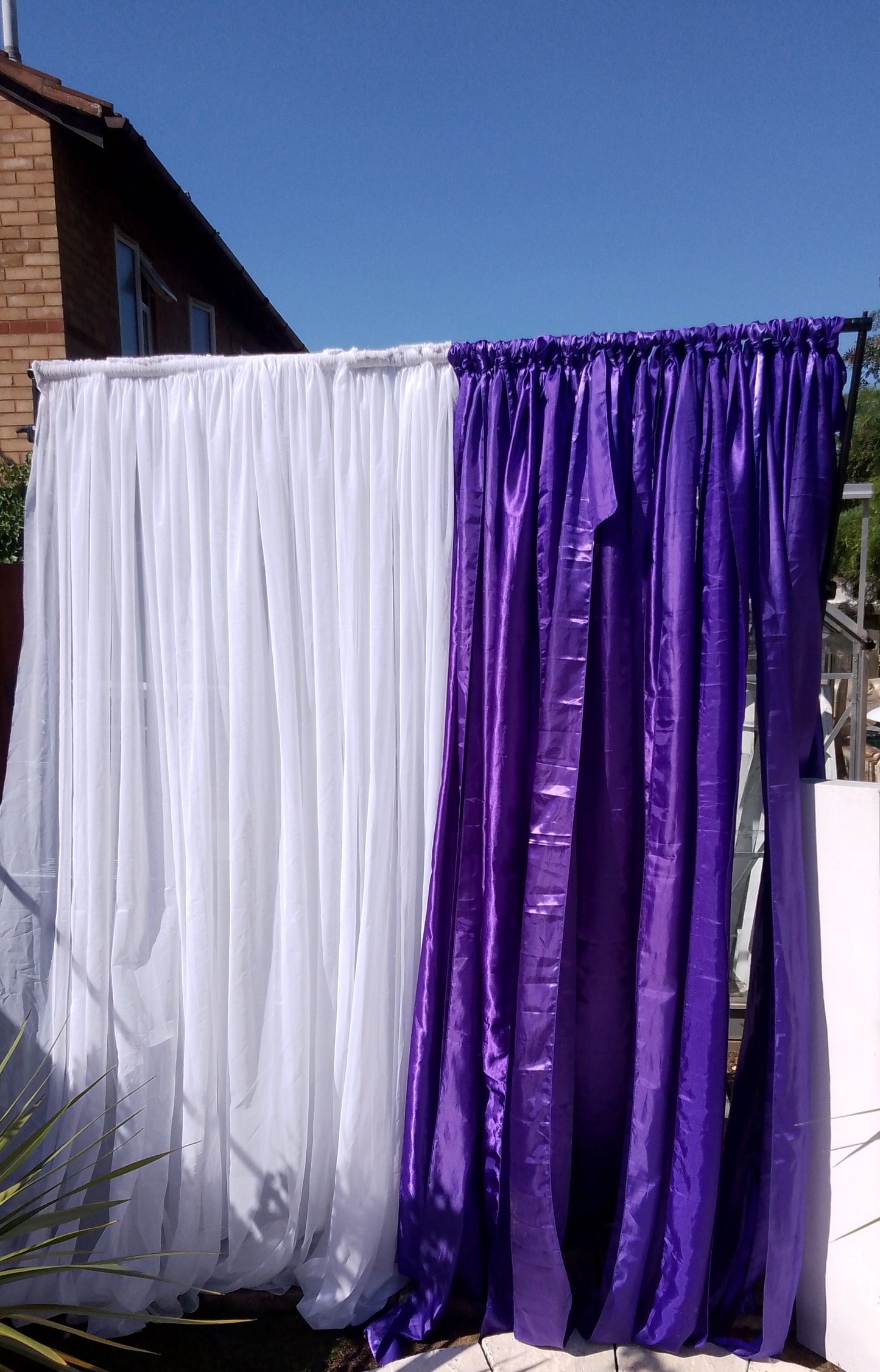 A Satin Sash Design Curtain backdrop hire 7ft wide x 7ft Height